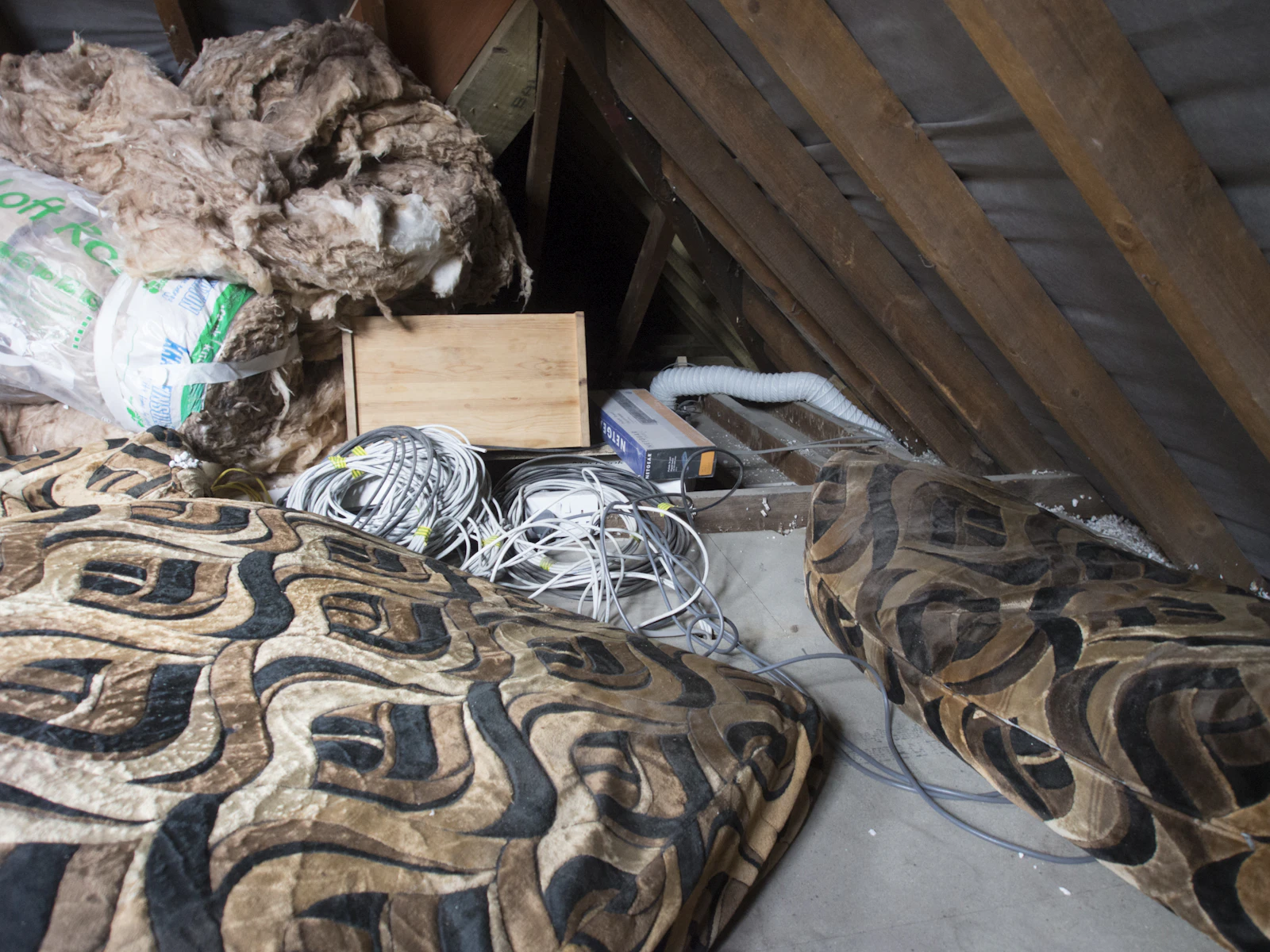 An open attic floor ready for blown-in insulation